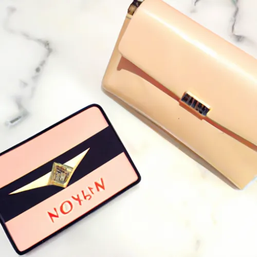 A stunning YSL clutch in a vibrant red hue, crafted from smooth leather and adorned with the iconic YSL logo on the front, making it a bold statement piece.