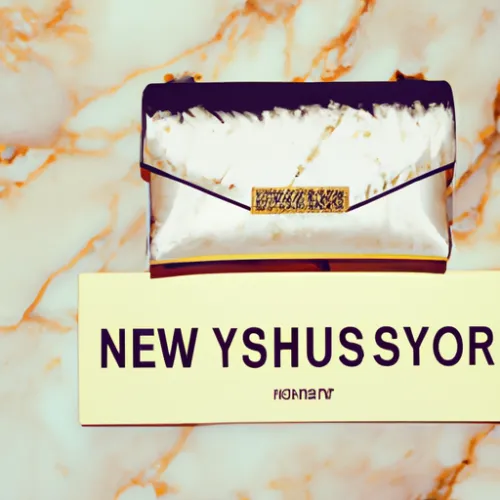 This elegant YSL clutch features a sleek black leather design with a gold-toned logo embellishment, perfect for adding a touch of luxury to any outfit.